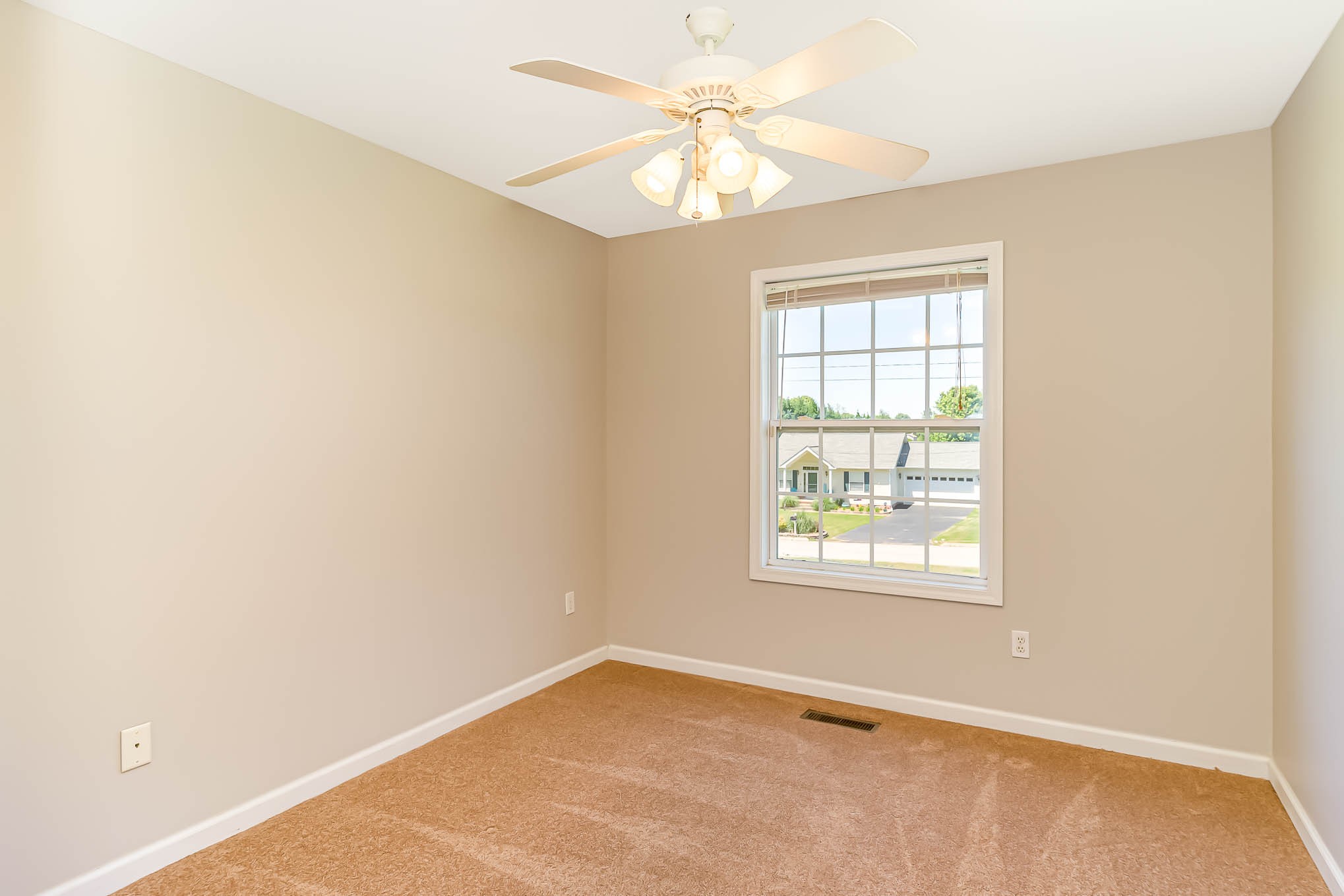 523 D V Circle Spring Hill, TN 37174 - Photo 18 of 25 an empty room with windows and chandelier fan