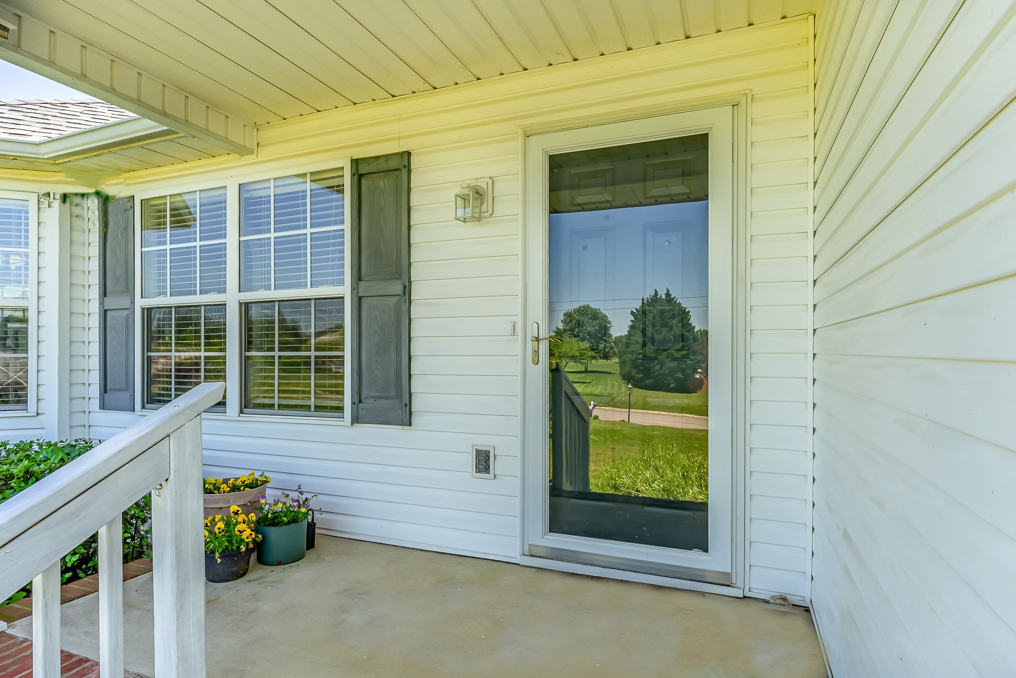 523 D V Circle Spring Hill, TN 37174 - Photo 3 of 25 a view of a porch with a table and chairs