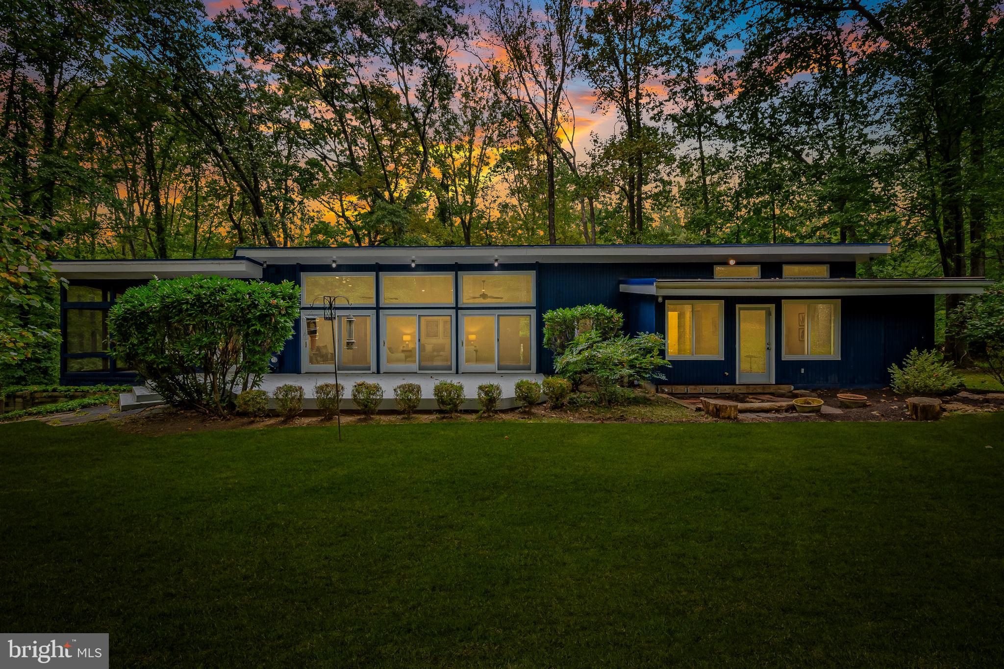 Back of the house at dusk from the backyard
