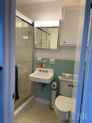 2548 Halifax Road Chatham, VA 24531 - Photo 14 of 21 a bathroom with a sink toilet and a mirror