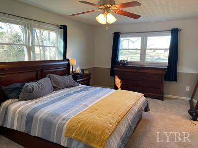 2548 Halifax Road Chatham, VA 24531 - Photo 15 of 21 a bedroom with a large bed and a large window