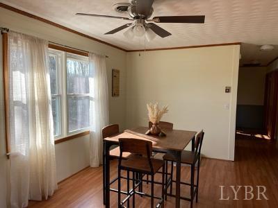 2548 Halifax Road Chatham, VA 24531 - Photo 16 of 21 a view of a dining room with furniture window and wooden floor