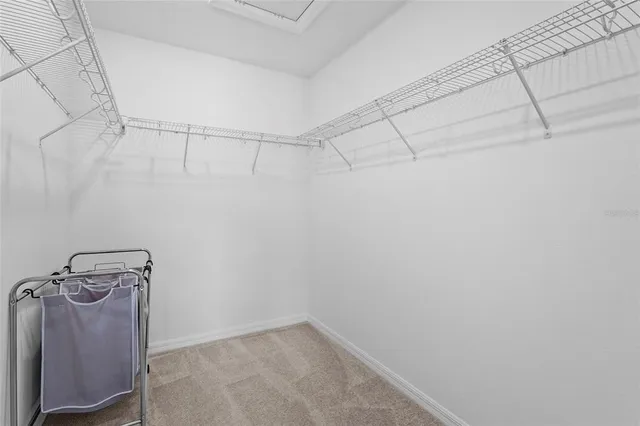 a room with a window and flowerpot