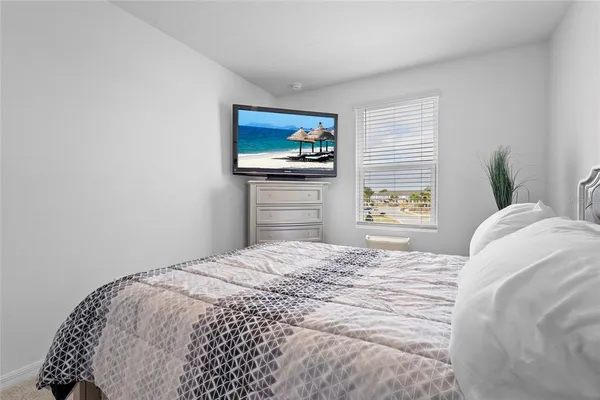a view of empty room with ceiling fan