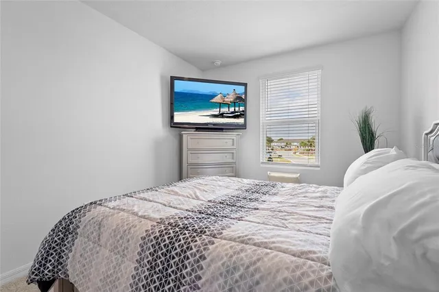 a view of empty room with ceiling fan