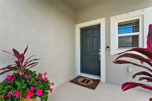 a kitchen with a sink a stove and cabinets