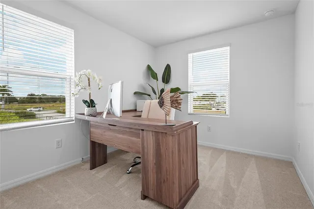 an aerial view of a house with a swimming pool yard and outdoor seating