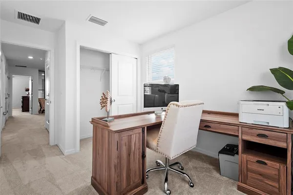 an aerial view of a house with a swimming pool outdoor seating and yard