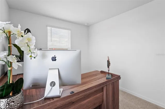 an aerial view of residential houses with outdoor space and swimming pool