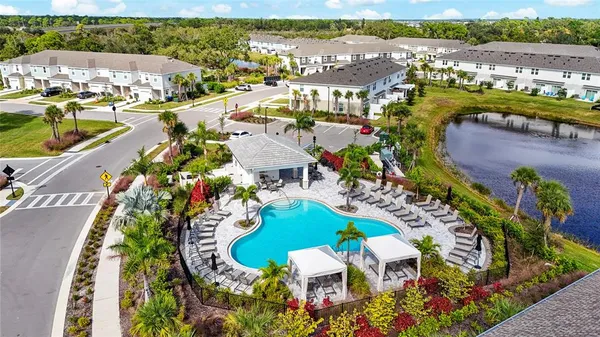 a view of a lake with a wooden bridge