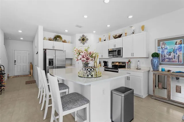 a living room with furniture a rug and a chandelier