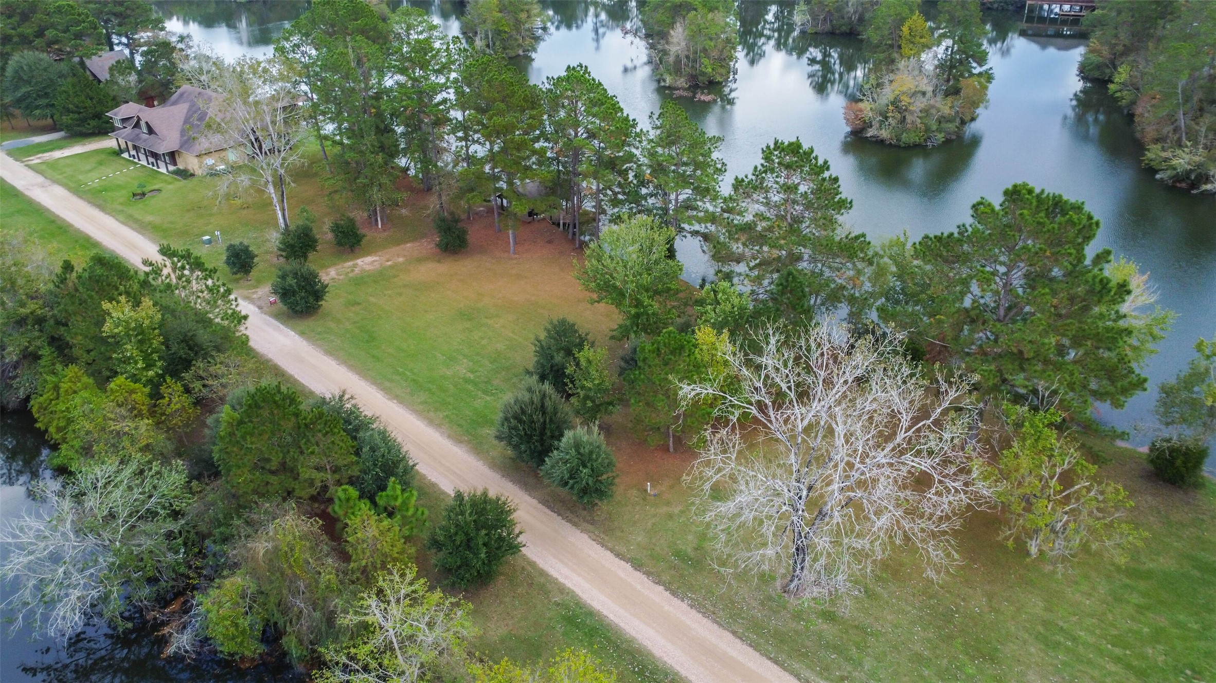 17-16 A Smith Loop North Cleveland, TX 77327 - Photo 14 of 38 a view of a garden with a lake