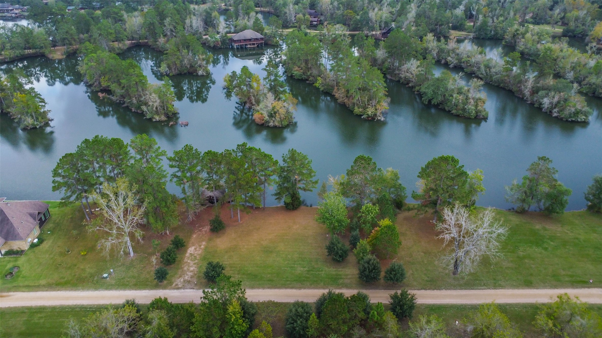 17-16 A Smith Loop North Cleveland, TX 77327 - Photo 16 of 38 an aerial view of a houses with yard