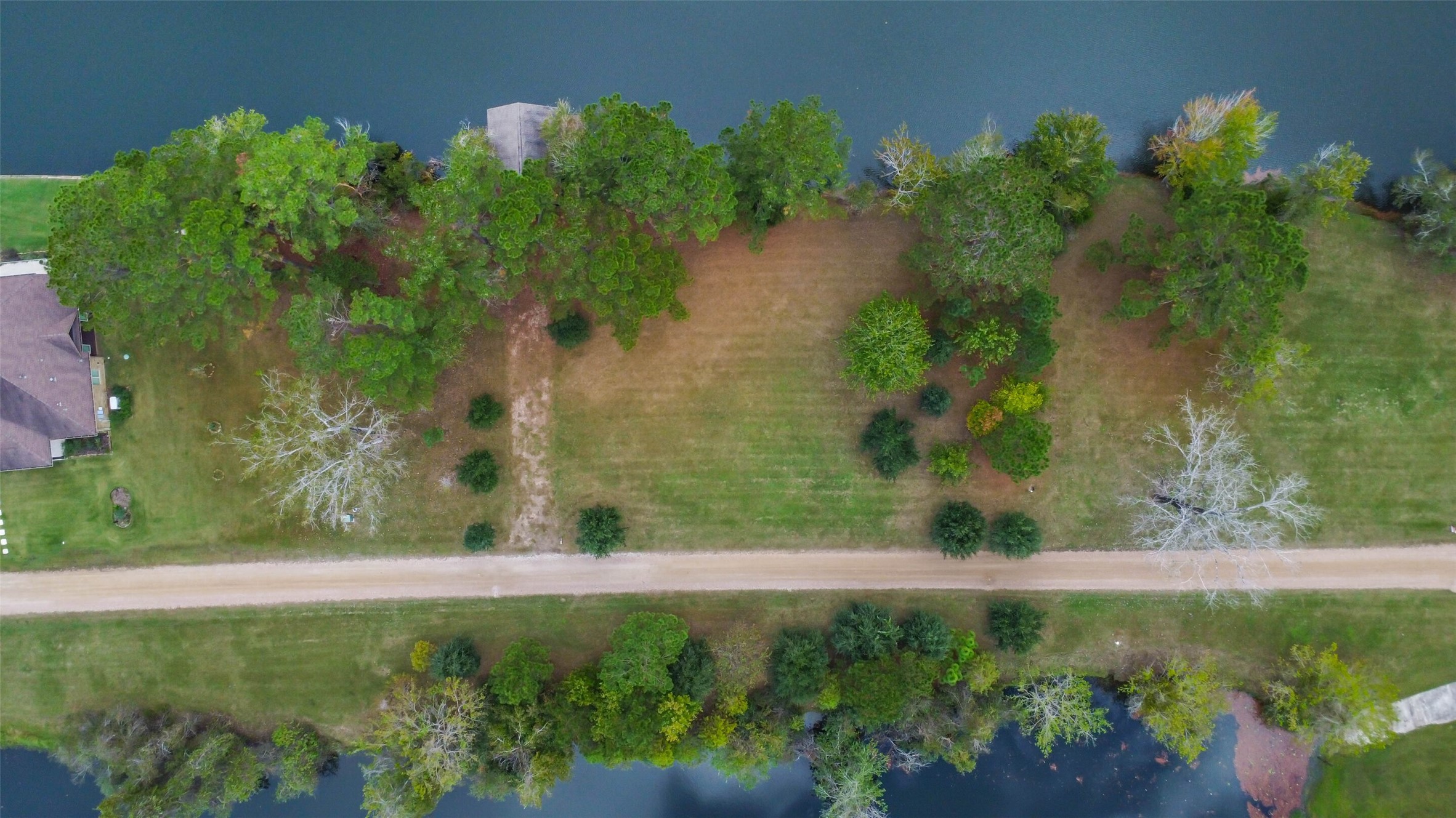 17-16 A Smith Loop North Cleveland, TX 77327 - Photo 19 of 38 a view of a garden with a lake