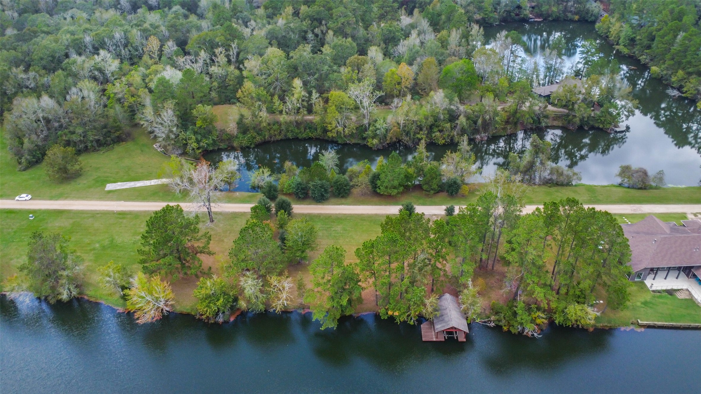 17-16 A Smith Loop North Cleveland, TX 77327 - Photo 20 of 38 a view of a lake with houses