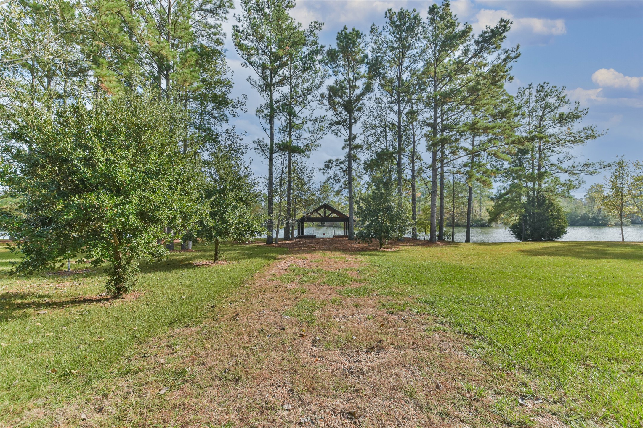 17-16 A Smith Loop North Cleveland, TX 77327 - Photo 30 of 38 a view of outdoor space with deck and trees