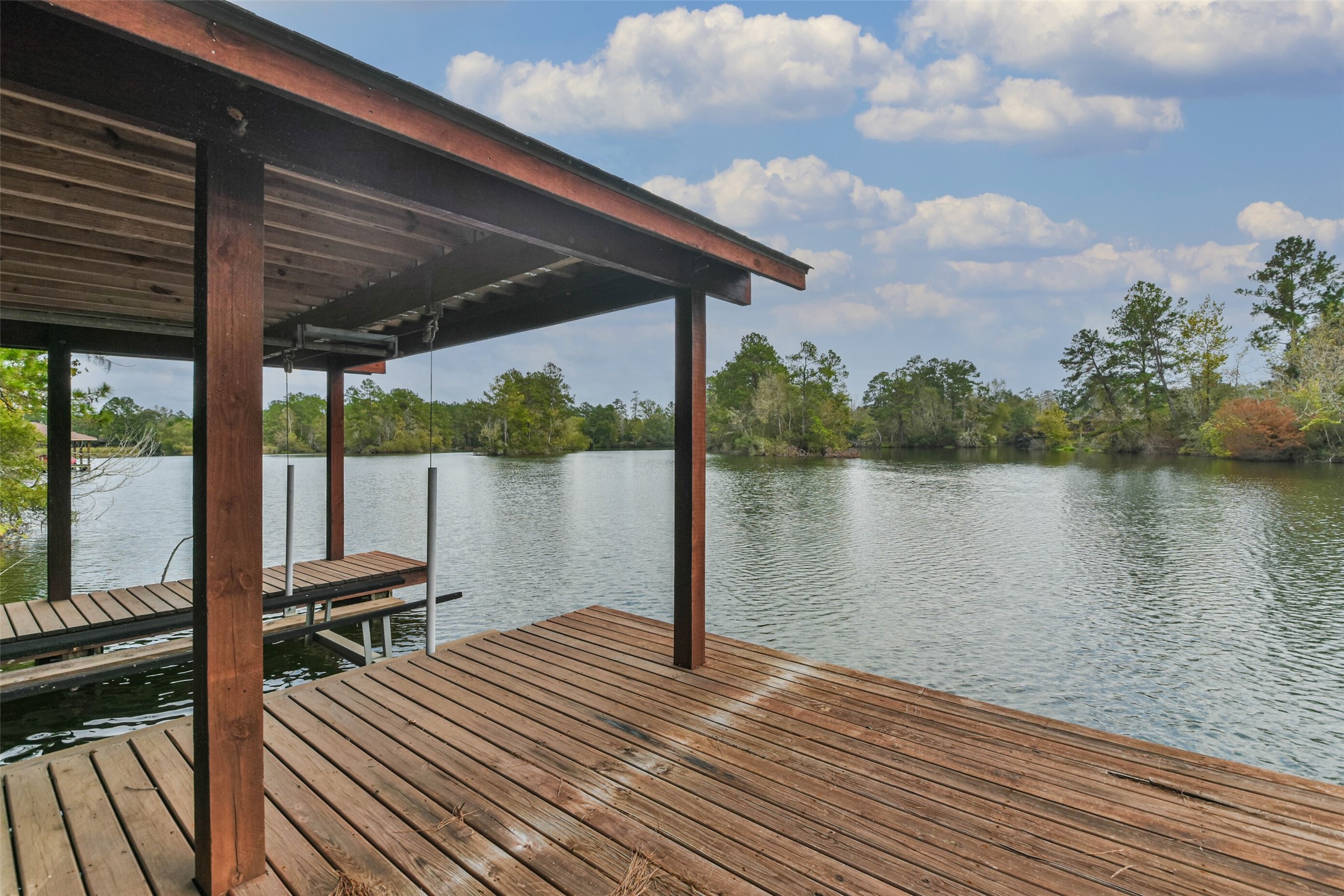 17-16 A Smith Loop North Cleveland, TX 77327 - Photo 36 of 38 a view of a balcony with chair and wooden floor