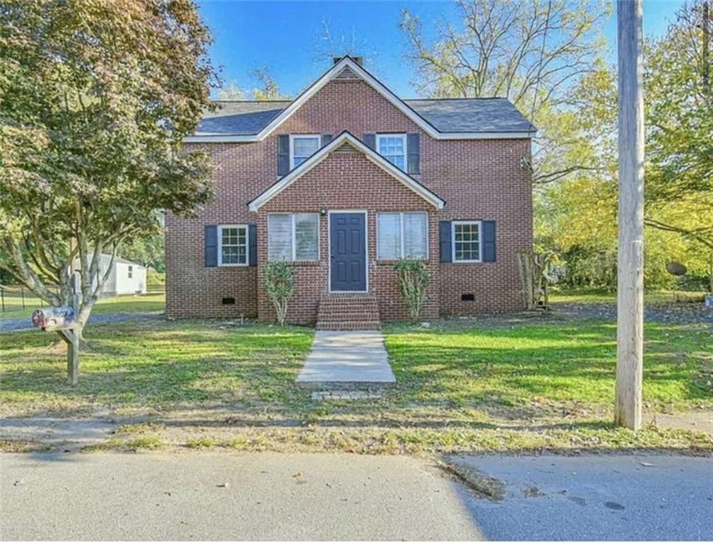 24 East Main Street Gainesville, GA 30501 - Photo 1 of 14 a front view of a house with a yard
