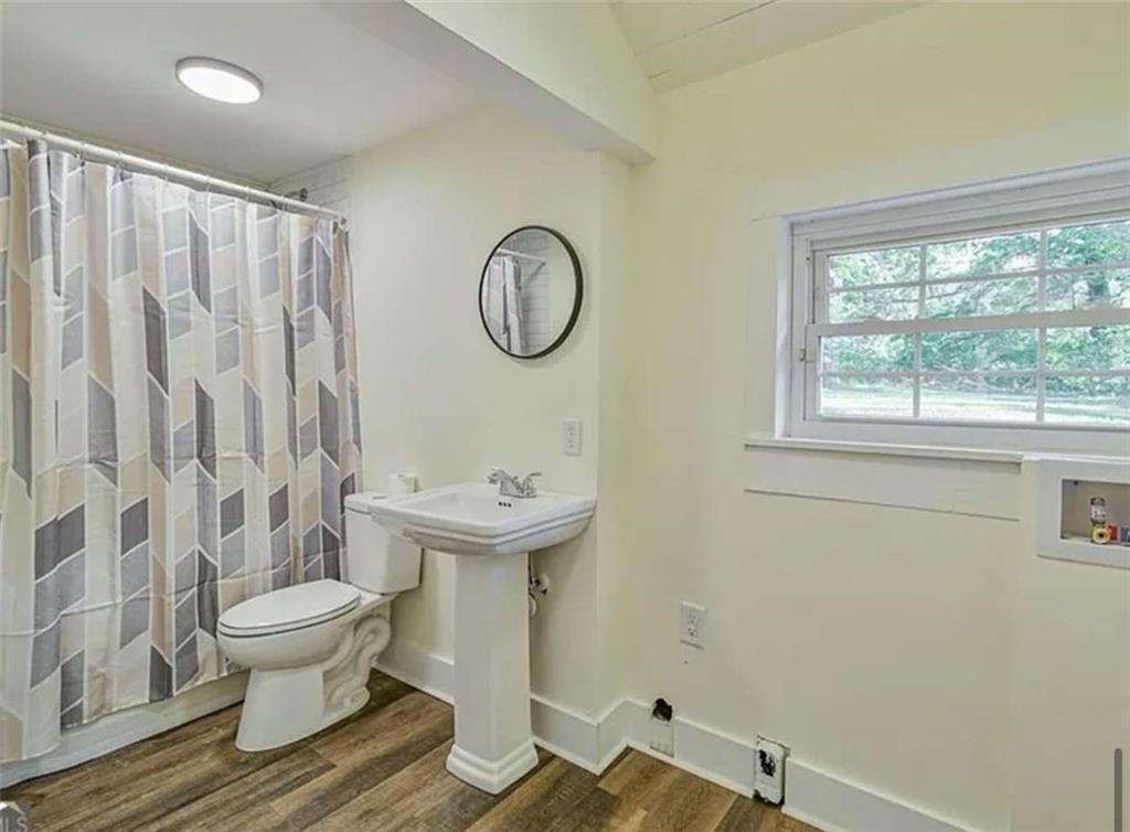 24 East Main Street Gainesville, GA 30501 - Photo 13 of 14 a bathroom with a sink and a toilet