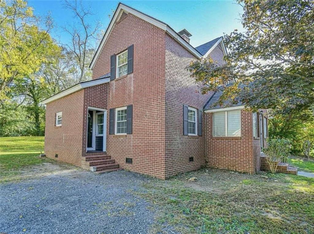 24 East Main Street Gainesville, GA 30501 - Photo 2 of 14 a view of a house with a yard