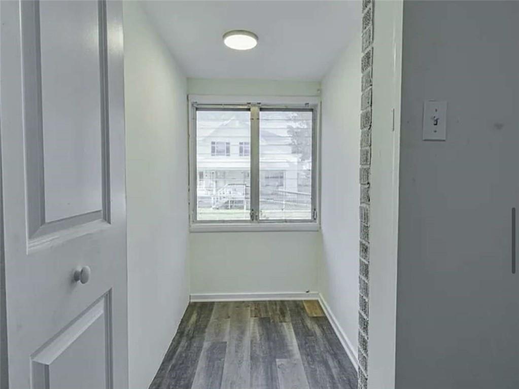 24 East Main Street Gainesville, GA 30501 - Photo 10 of 14 a view of a room with wooden floor and window