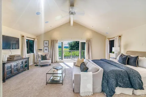 a living room with furniture fireplace and flat screen tv