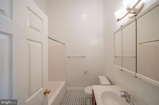 a bathroom with a sink and toilet