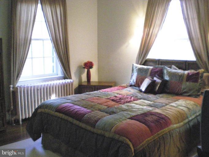1503 Frederick Road Catonsville, MD 21228 - Photo 15 of 23 a bedroom with a bed and a window