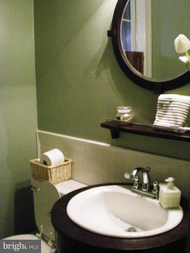 1503 Frederick Road Catonsville, MD 21228 - Photo 18 of 23 a bathroom with a sink and a mirror