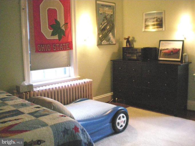 1503 Frederick Road Catonsville, MD 21228 - Photo 20 of 23 a bedroom with a bed and a painting on the wall