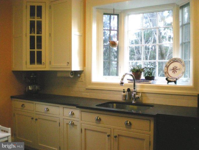 1503 Frederick Road Catonsville, MD 21228 - Photo 22 of 23 a bathroom with a granite countertop cabinets and a sink