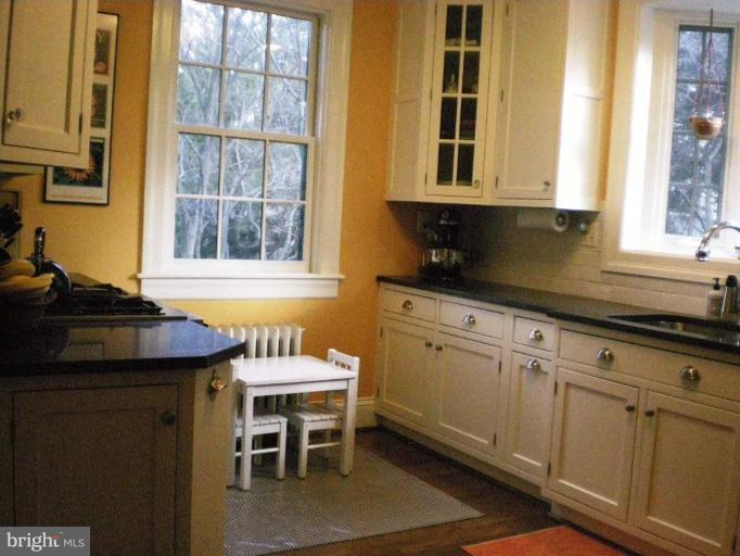 1503 Frederick Road Catonsville, MD 21228 - Photo 23 of 23 a kitchen with stainless steel appliances granite countertop a stove and a sink