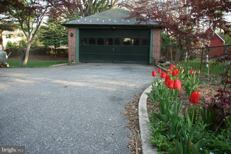 1503 Frederick Road Catonsville, MD 21228 - Photo 7 of 23 a front view of a house with a yard