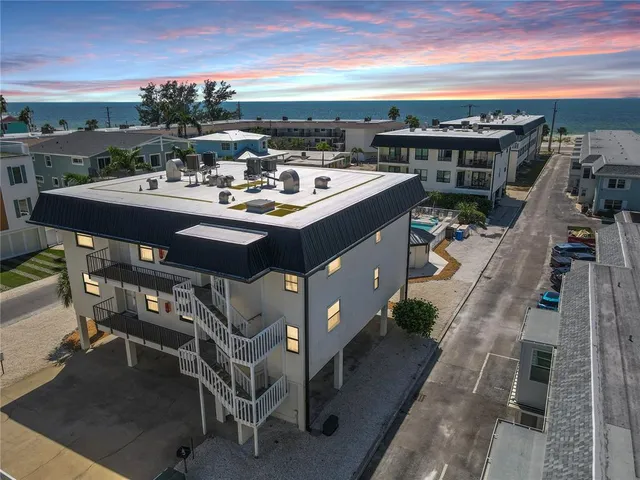 a view of a terrace with furniture and a kitchen