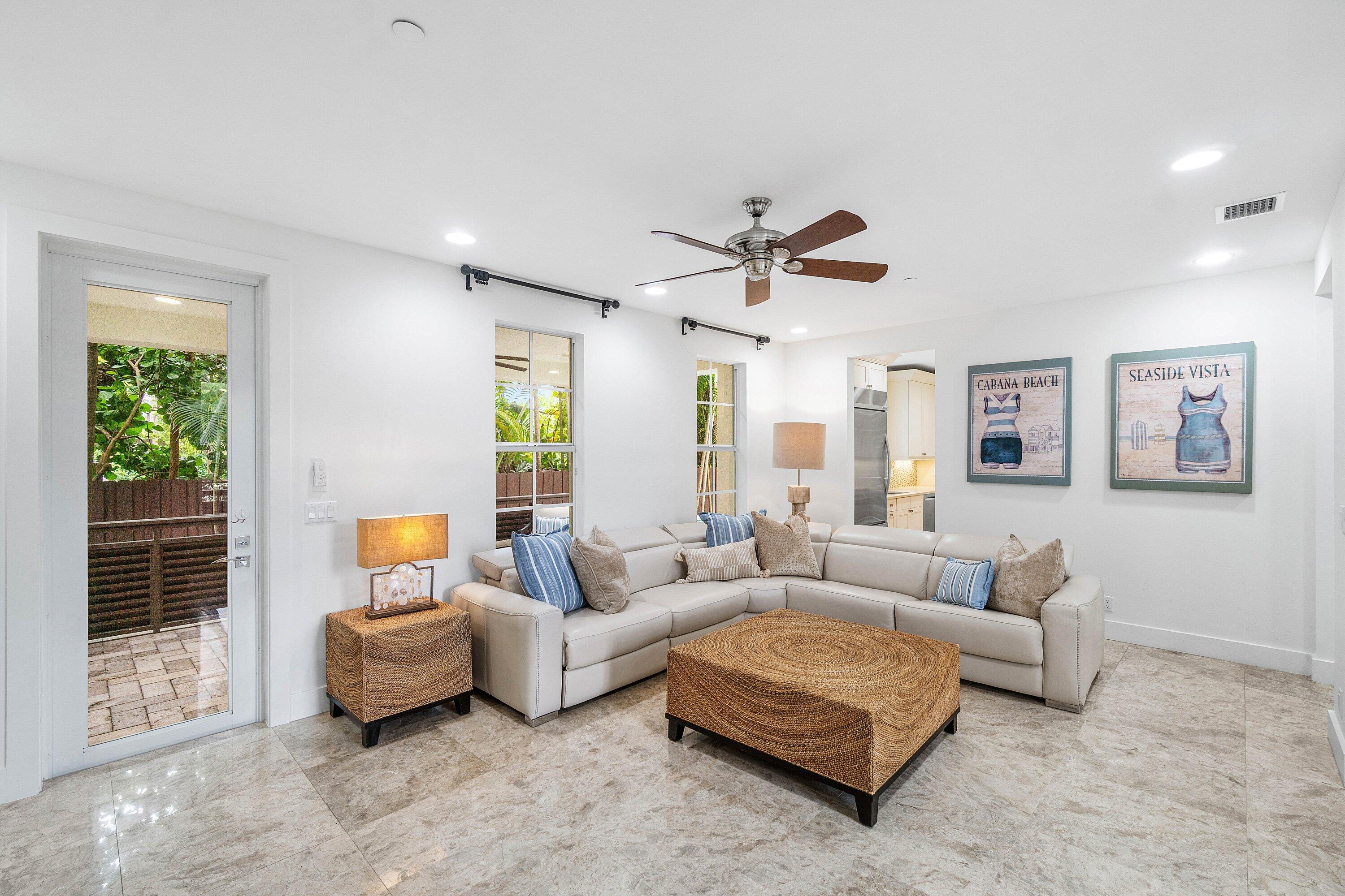 1108 Coconut Row Delray Beach, FL 33483 - Photo 11 of 31 a living room with furniture and a large window