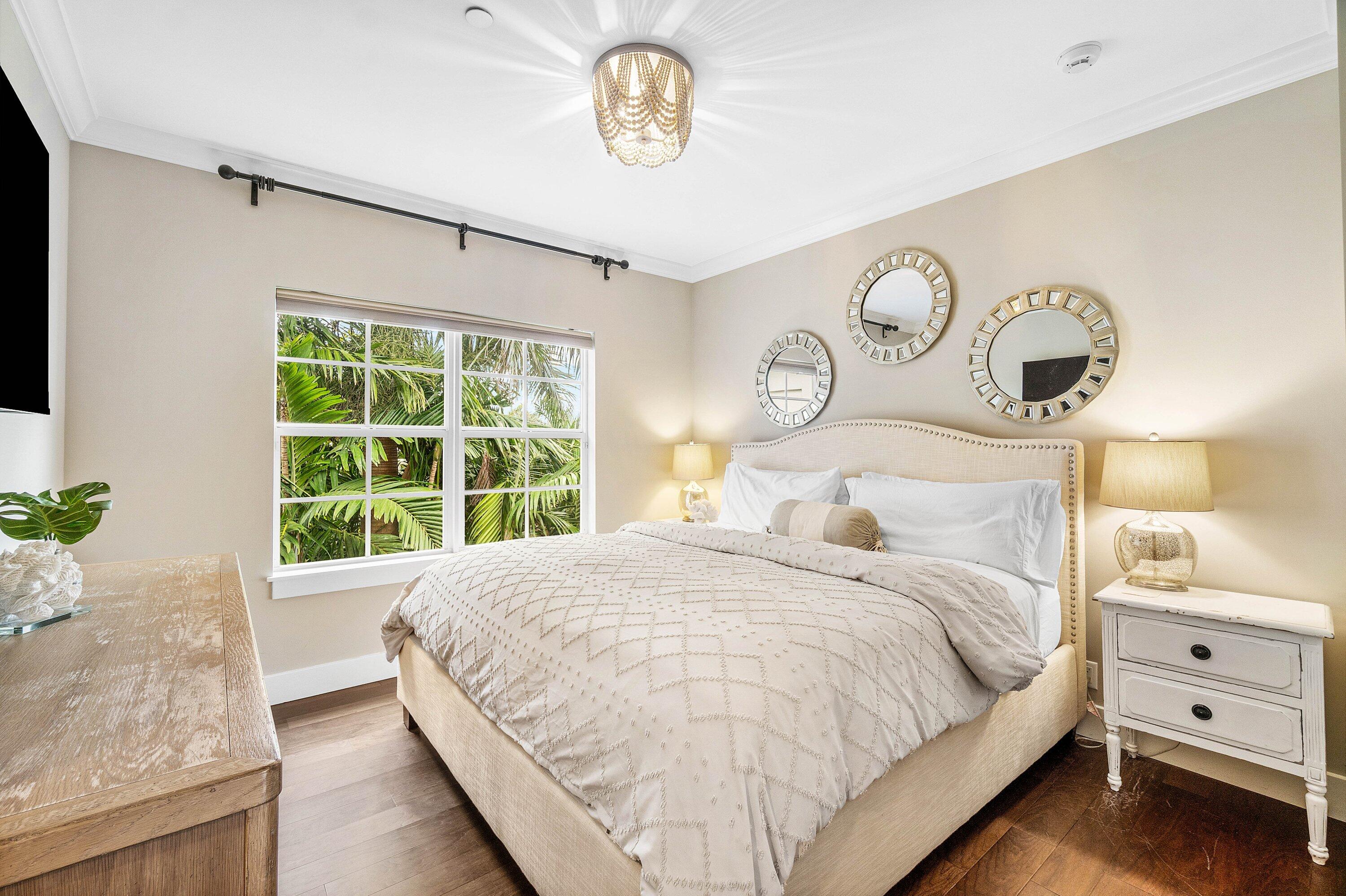 1108 Coconut Row Delray Beach, FL 33483 - Photo 20 of 31 a bedroom with a bed and a window