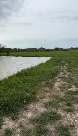 a view of a lake with mountain in the background