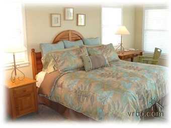 110 Sand Dunes Road Santa Rosa Beach, FL 32459 - Photo 11 of 15 a large bed sitting in a bedroom next to a window