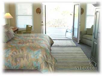 110 Sand Dunes Road Santa Rosa Beach, FL 32459 - Photo 15 of 15 a spacious bedroom with a large bed and a large window