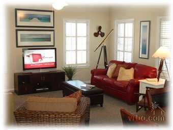 110 Sand Dunes Road Santa Rosa Beach, FL 32459 - Photo 8 of 15 a living room with furniture a window and a flat screen tv