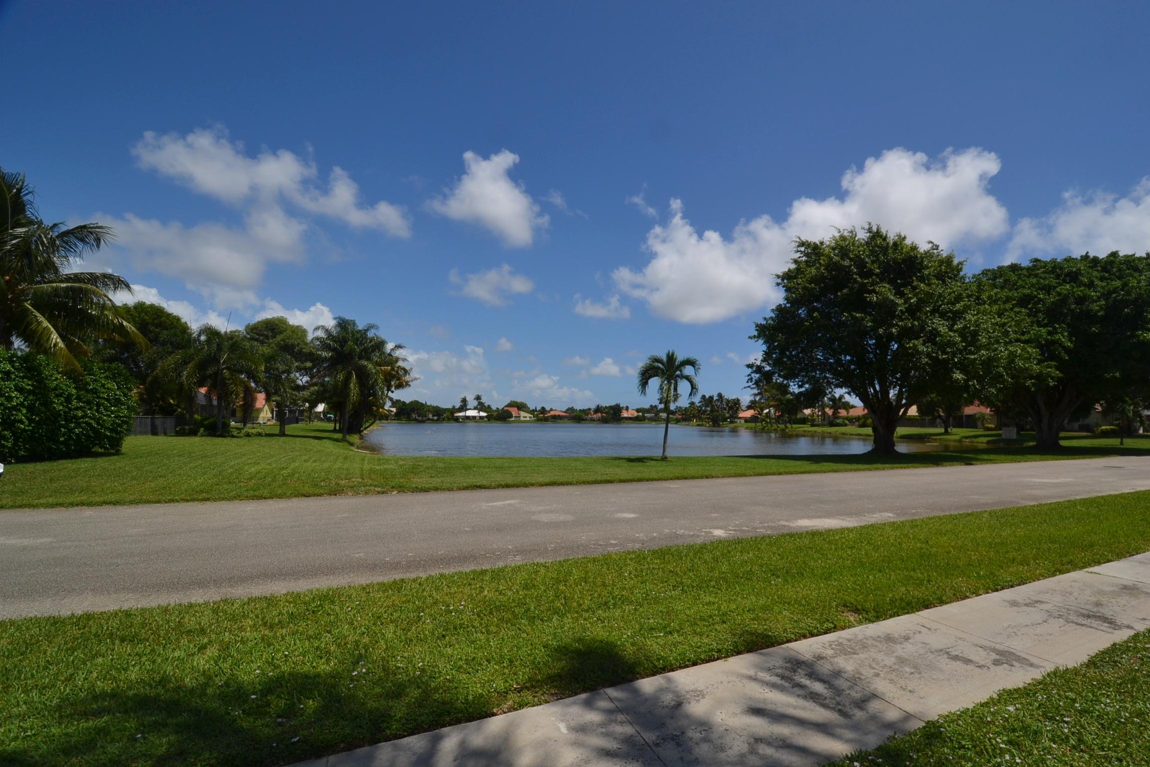 460 Northwest 70th Street Boca Raton, FL 33487 - Photo 3 of 36 lake from yard