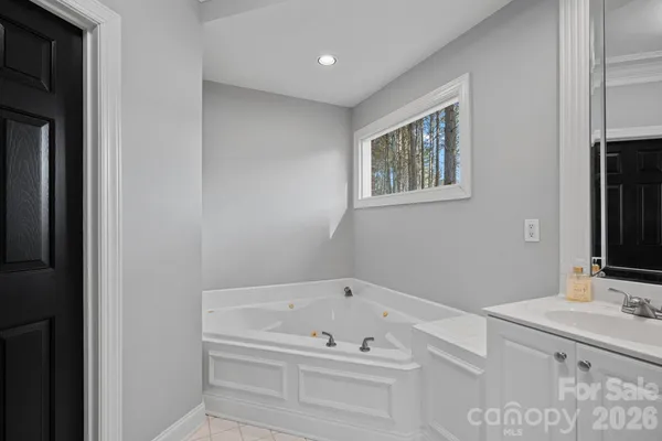 a bathroom with a bathtub and a sink