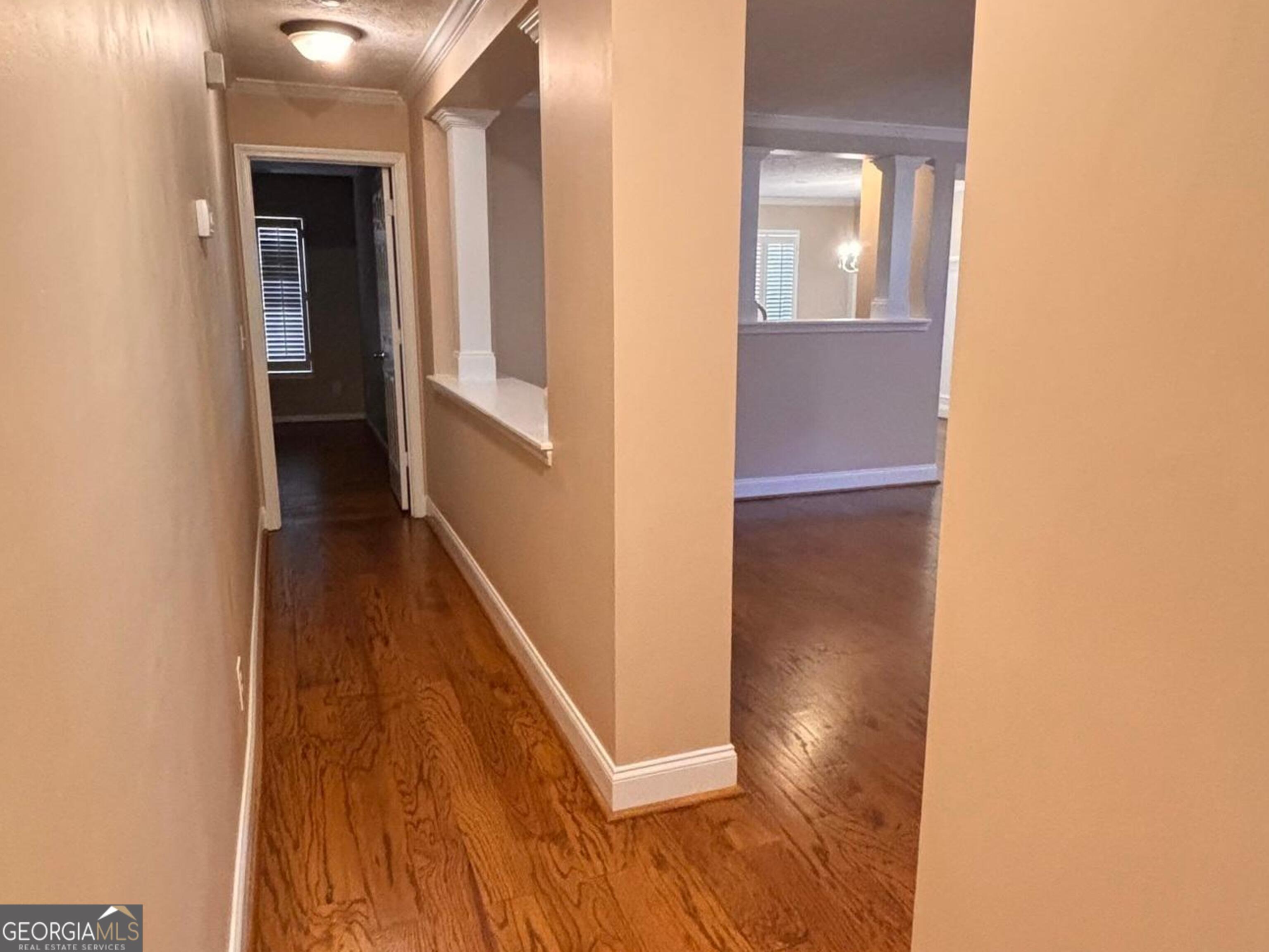 120 Cedar Bay Circle Dallas, GA 30157 - Photo 12 of 27 a view of a hallway with wooden floor and staircase