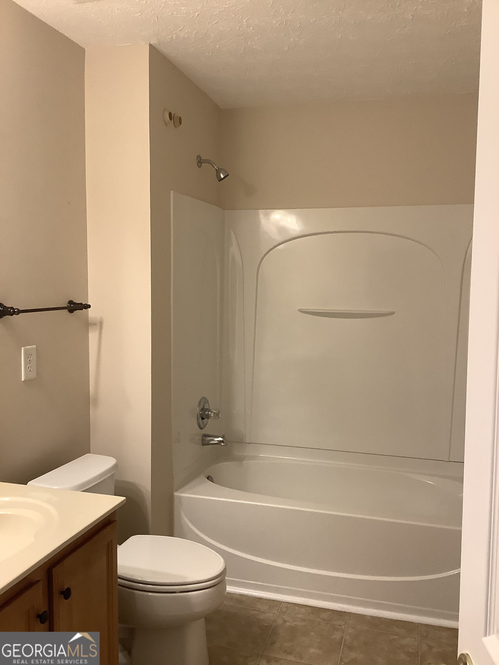 120 Cedar Bay Circle Dallas, GA 30157 - Photo 16 of 27 a bathroom with a granite countertop toilet a sink and a bathtub