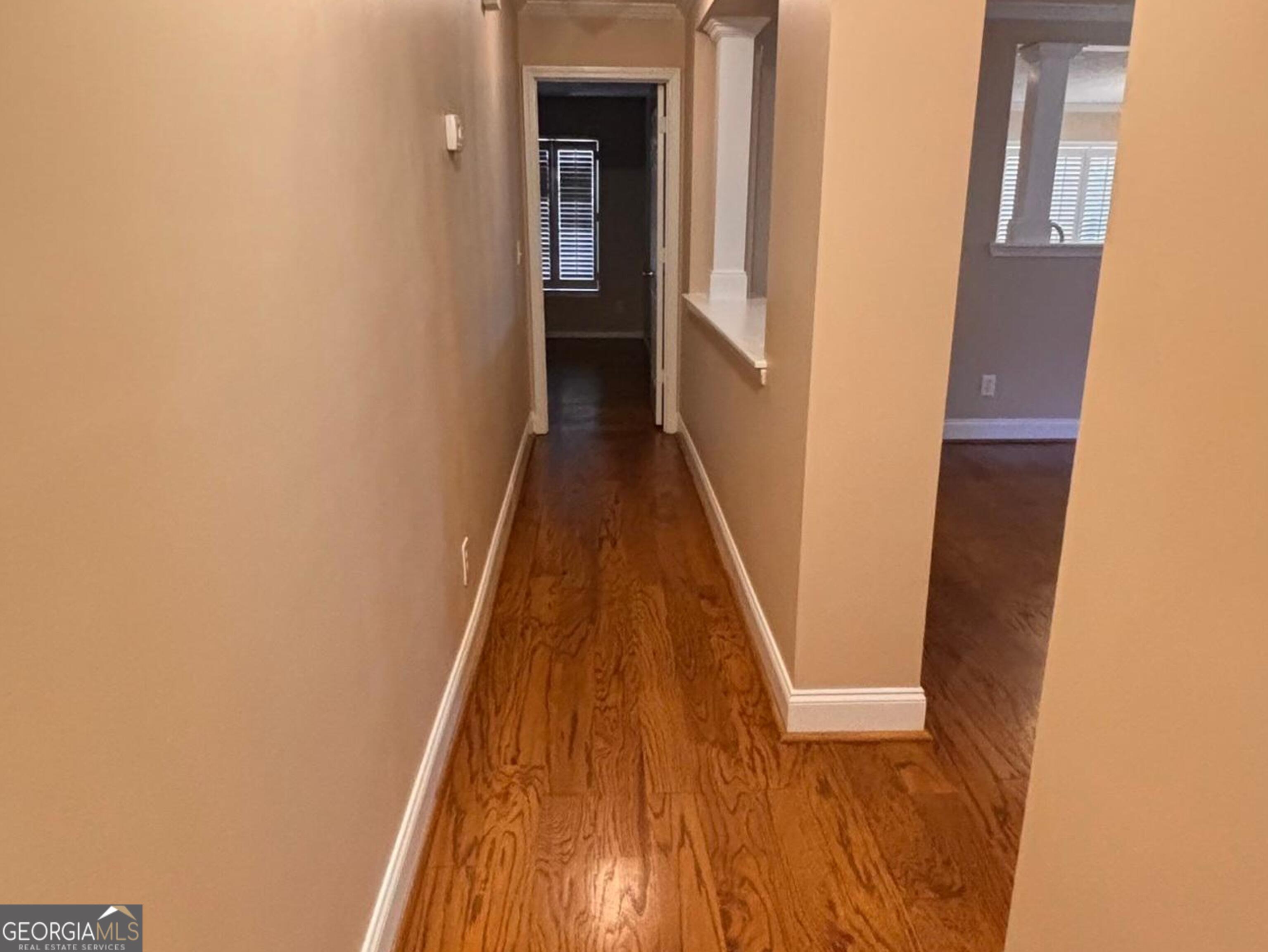 120 Cedar Bay Circle Dallas, GA 30157 - Photo 17 of 27 a view of a hallway with wooden floor and staircase