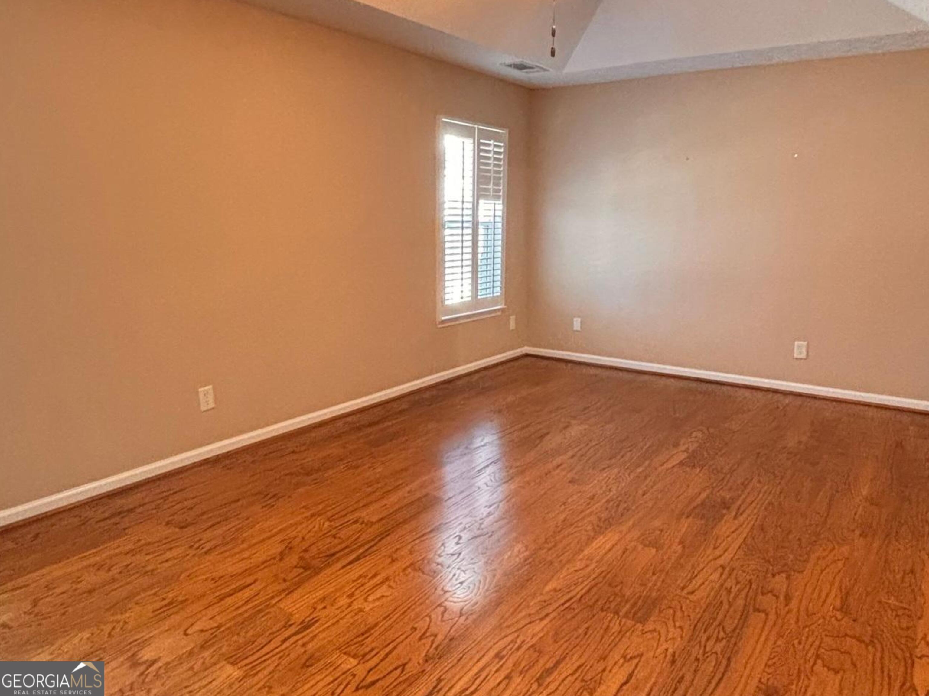 120 Cedar Bay Circle Dallas, GA 30157 - Photo 20 of 27 a view of an empty room with wooden floor and a window