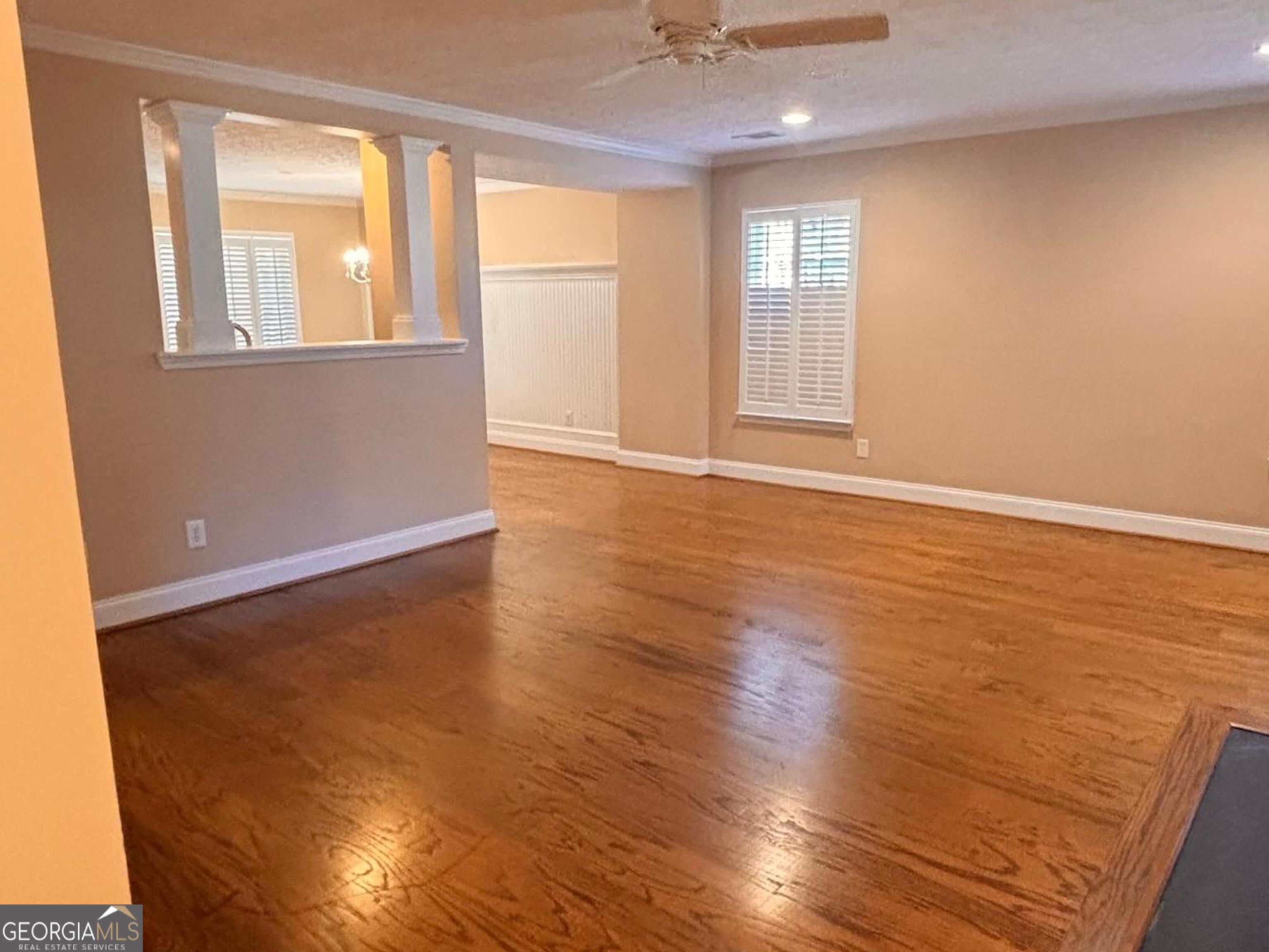 120 Cedar Bay Circle Dallas, GA 30157 - Photo 6 of 27 a view of an empty room with wooden floor and a window