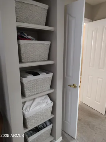a living room with furniture and a gate