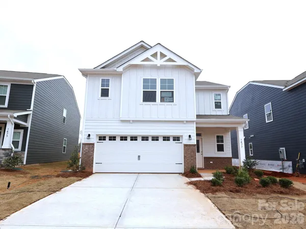 a front view of a house with garage