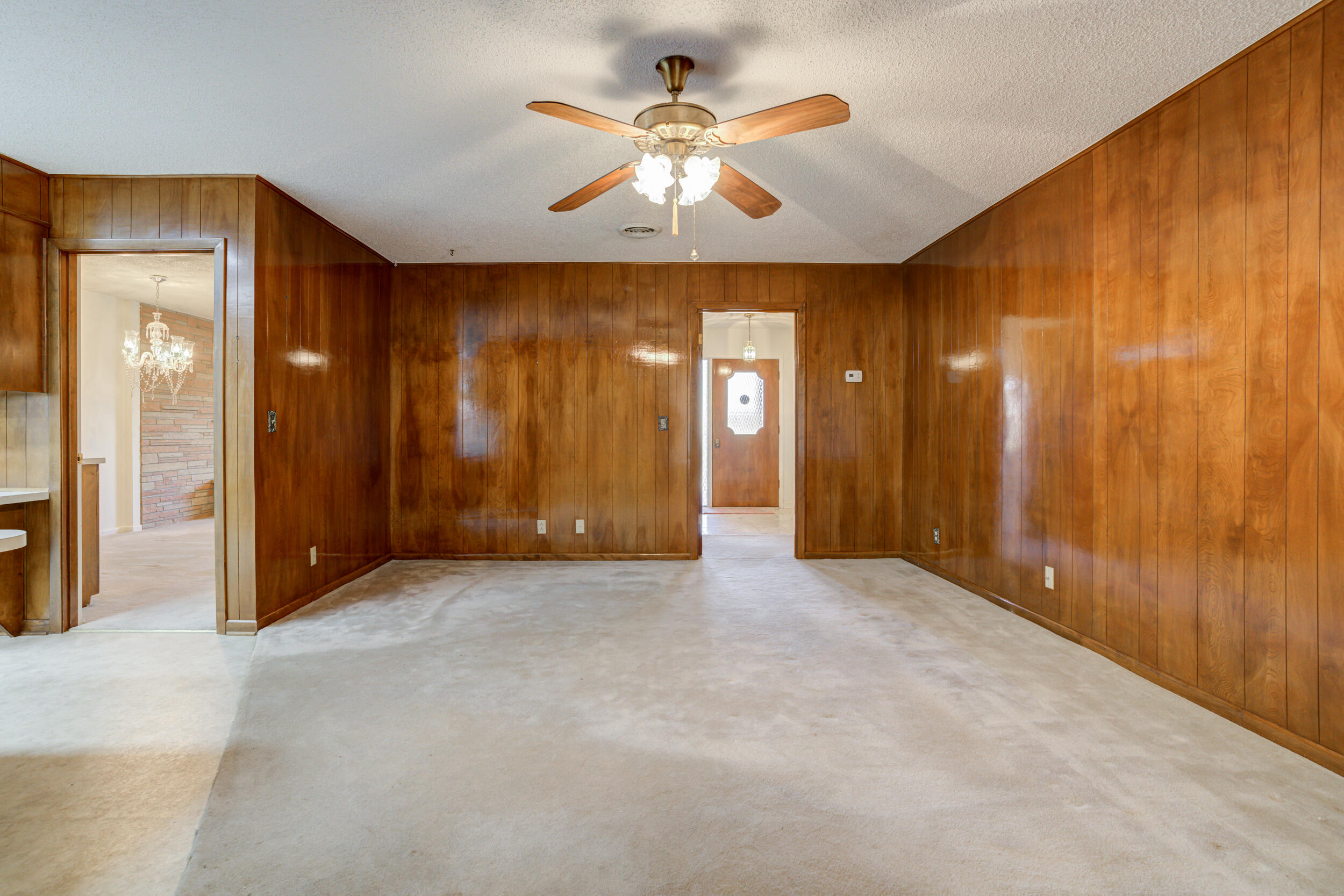 509 18th Street Seagraves, TX 79359 - Photo 12 of 25 an empty room with fan and windows